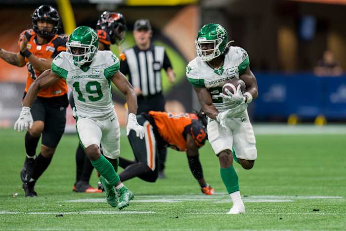 Aug 26, 2022; Vancouver, British Columbia, CAN; Saskatchewan Roughriders wide receiver Samuel Emilus (19) and running back Frankie Hickson (20) run upfield against the BC Lions in the second half at BC Place. Mandatory Credit: Bob Frid-USA TODAY Sports